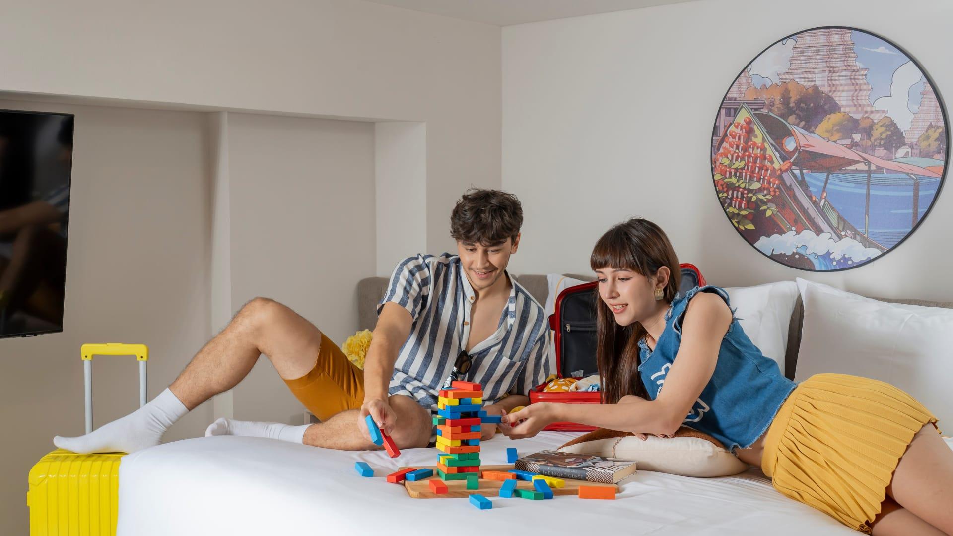 Couple playing games in hotel room