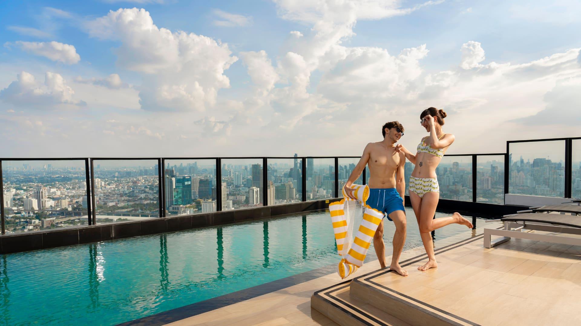 Couple at rooftop pool